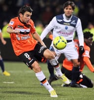 Lorient's midfielder Yann Jouffre (L) controls the ball on January 19, 2013, at the Moustoir Stadium in Lorient