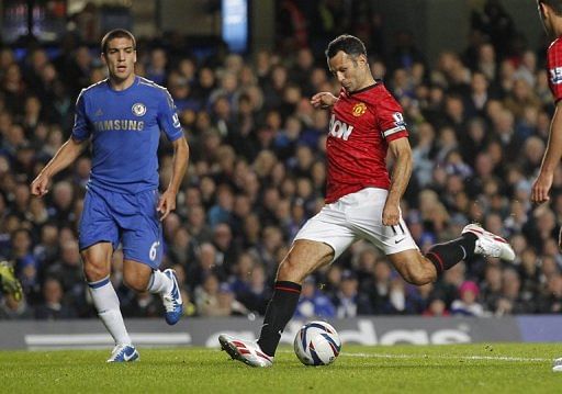 Manchester United midfielder Ryan Giggs scores the opening goal at Chelsea in the League Cup on October 31, 2012