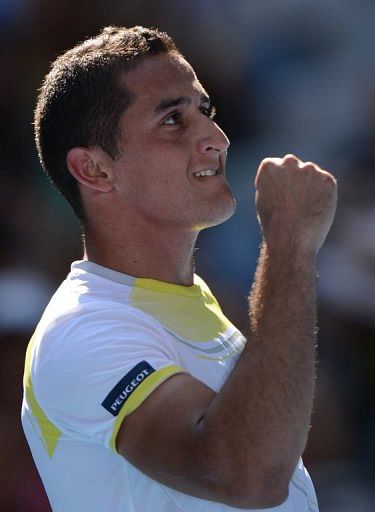 Nicolas Almagro celebrates victory in his match against Janko Tipsarevic, in Melbourne, on January 20, 2013