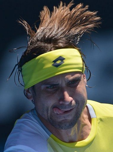David Ferrer hits a ball to Kei Nishikori at the Australian Open in Melbourne on January 20, 2013