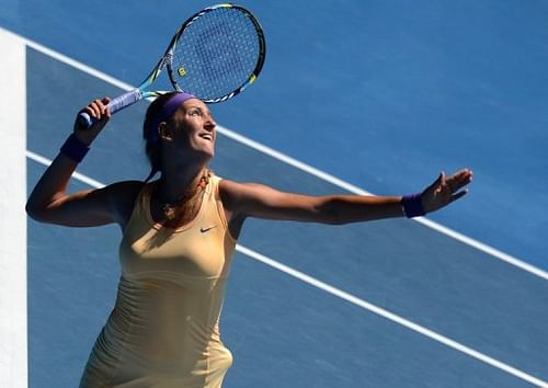 Victoria Azarenka serves against Elena Vesnina, in Melbourne, on January 21, 2013