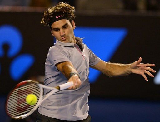 Roger Federer hits a return against Milos Raonic during their Australian Open match in Melbourne on January 21, 2013