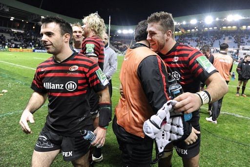 Saracens&#039;s flanker Kelly Brown (R) celebrates with teammates on January 12, 2013, at the Beaujoire Stadium in Nantes