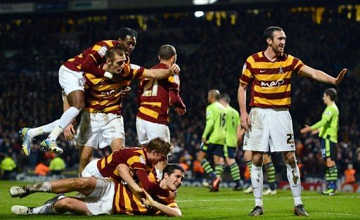 Bradford City&#039;s Carl McHugh (bottom) celebrates after scoring the third goal against Aston Villa, January 8, 2013