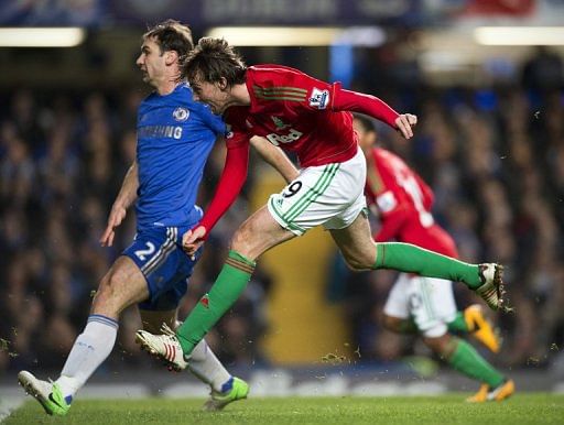 Michu scores the opening goal against Chelsea during their League Cup semi-final first leg on January 9, 2013