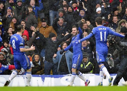 Juan Mata (C) celebrates scoring the first goal during the match against Arsenal at Stamford Bridge on January 20, 2013