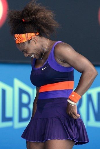 Serena Williams winces in pain during her match against Sloane Stephens at the Australian Open on January 23, 2013