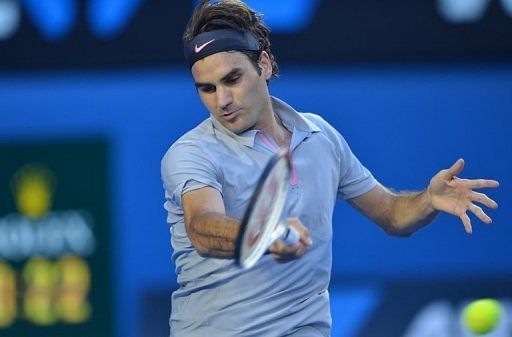 Roger Federer plays a return during his quarter-final match against Jo-Wilfried Tsonga in Melbourne, on January 23, 2013