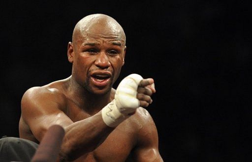 Floyd Mayweather points to the crowd after his bout against Puerto Rico&#039;s Miguel Cotto in Las Vegas on May 5, 2012