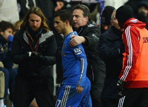 Chelsea&#039;s Eden Hazard is escorted off the pitch on January 23, 2013