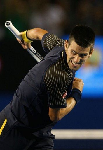 Serbia's Novak Djokovic celebrates after defeating Spain's David Ferrer at the Australian Open on January 24, 2013