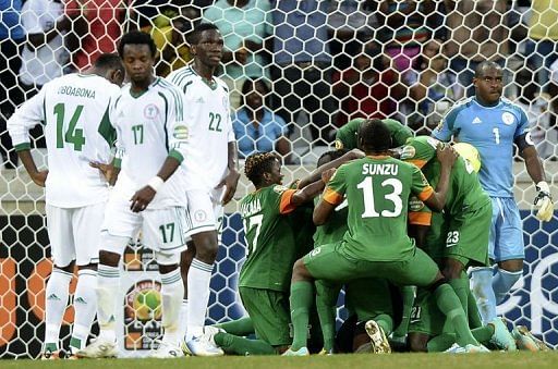 Zambia  players celebrate at the team&#039;s goalkeeper scored a penalty on January 25, 2013