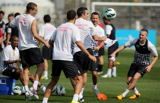 Manchester United players attend a training session in the Qatari capital Doha, on January 22, 2013