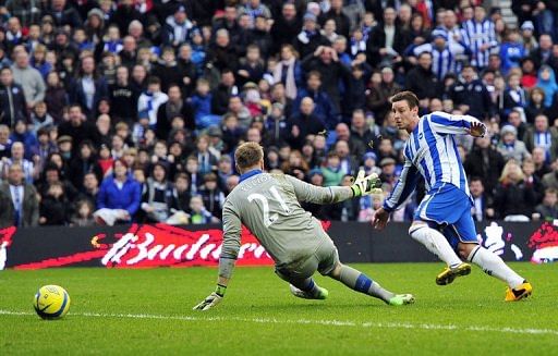 Brighton &amp; Hove Albion&#039;s Will Hoskins (R) scores their second goal past Newcastle goalkeeper Rob Elliot, January 5, 2013