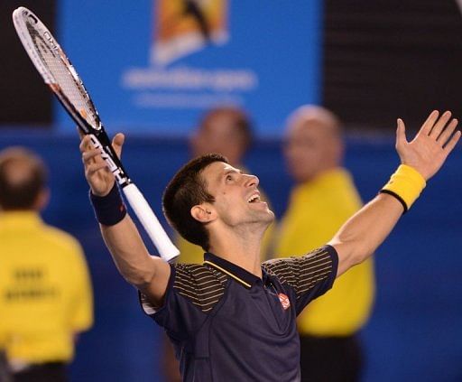Serbia&#039;s Novak Djokovic celebrates after beating Andy Murray to win the Australian Open in Melbourne on January 27, 2013