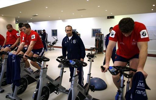 France rugby coach Philippe Saint Andre (C) during an indoor training session with his players on January 27, 2013