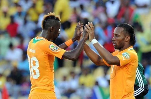 Ivory Coast forward Didier Drogba (R) celebrates with Lacina Traore during the Cup of Nations on January 26, 2013