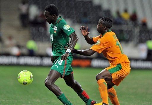 Burkina Faso&#039;s Wilfried Balima (L) and Zambia&#039;s Emmanuel Mbola during their Africa Cup match on January 29, 2013