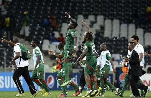 Burkina Faso players celebrate after defeating Zambia at the Africa Cup of Nations in Nespruit on January 29, 2013