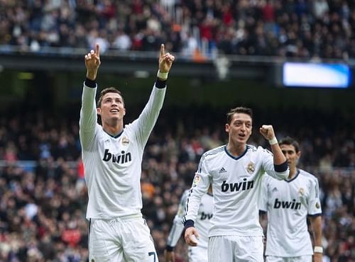 Real Madrid forward Cristiano Ronaldo (L) celebrates after scoring during a Spanish league game on January 27, 2013 Real Madrid forward Cristiano Ronaldo (L) celebrates after scoring during a Spanish league game on January 27, 2013