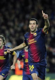 Barcelona midfielder Sergio Busquets (C) celebrates after scoring during a Spanish league match on December 16, 2012