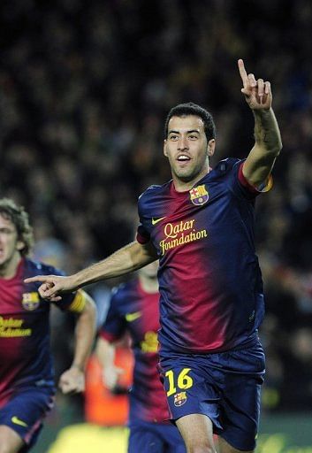 Barcelona midfielder Sergio Busquets (C) celebrates after scoring during a Spanish league match on December 16, 2012 Barcelona midfielder Sergio Busquets (C) celebrates after scoring during a Spanish league match on December 16, 2012