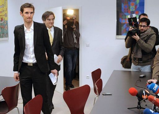 Frank Schleck (L) arrives with his lawyer Albert Rodesch on January 30, 2013 in Luxembourg