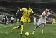 Togo's Emmanuel Adebayor (L) fights for the ball with Tunisia's Aymen Abdennour (R) on January 30, 2013 in Nelspruit