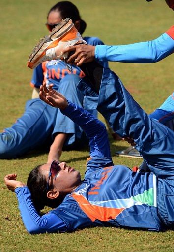 India women's cricket team captain Mithali Raj gets some help to stretch after a training session on January 22, 2013 India women's cricket team captain Mithali Raj gets some help to stretch after a training session on January 22, 2013