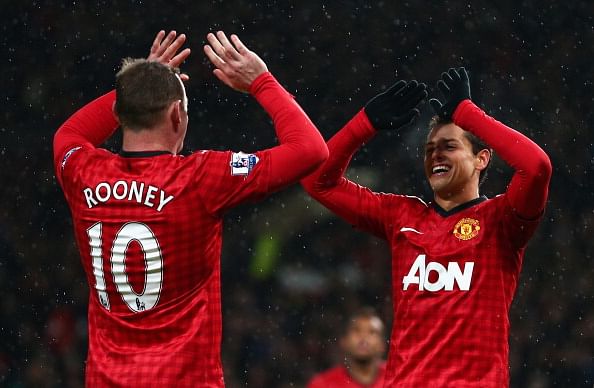 MANCHESTER, ENGLAND - JANUARY 26:  Javier Hernandez of Manchester United celebrates scoring his team&#039;s third goal with team-mate Wayne Rooney during the FA Cup with Budweiser Fourth Round match between Manchester United and Fulham at Old Trafford
