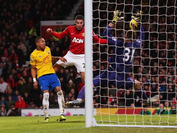 MANCHESTER, ENGLAND - JANUARY 30:  Artur Boruc of Southampton makes a save from Robin van Persie of Manchester United 