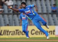 India's bowler Varun Aaron tries to catc