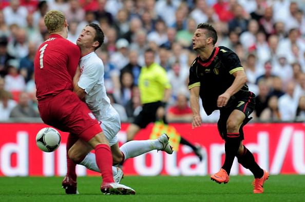 Gary Cahill (C) of England collides with goalkeeper Joe Hart of England after he was pushed by Dries Mertens (R) of Belgium during the international friendly match between England and Belgium at Wembley Stadium on June 2, 2012 in London, England.  (Photo by Shaun Botterill/Getty Images)