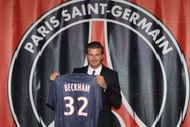 PARIS, FRANCE - JANUARY 31: International soccer player David Beckham poses with his PSG Football shirt after his PSG signature at Parc des Princes on January 31, 2013 in Paris, France. (Photo by Marc Piasecki/Getty Images)