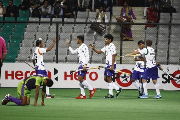 NEW DELHI, INDIA - FEBRUARY 7: UP Wizards players celebrates a goal against Delhi Waveriders during Hockey India League match at Major Dhyan Chand Stadium on February 7, 2013 in New Delhi, India. 