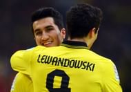 Nuri Sahin of Dortmund smiles with Robert Lewandowski during a Bundesliga match