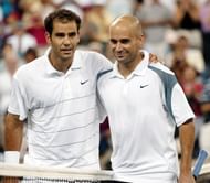 Pete Sampras (L) of the US walks arm-in-arm with c
