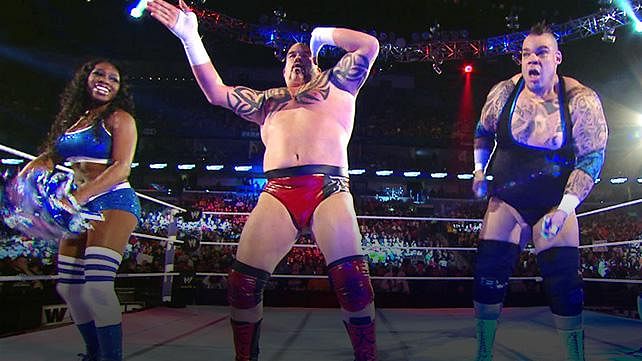 Brodus Clay and Tensai celebrate after their victory
