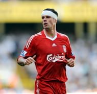 LONDON, ENGLAND - AUGUST 16: (THE SUN OUT) Jamie Carragher of Liverpool wears a bandage around his head after clashing heads with teammate Martin Skrtel whilst going up for a header during the Barclays Premier league match between Tottenham Hotspur and Liverpool at White Hart Lane on August 16, 2009 in London, England.