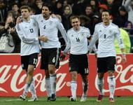 Germany's midfielder Sami Khedira (C) celebrates with Germany's midfielder Thomas Mueller after scoring against France