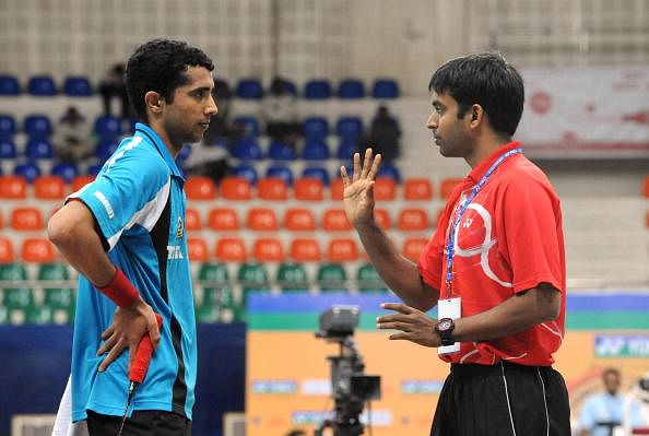 India&#039;s badminton player Arvind Bhat (L)