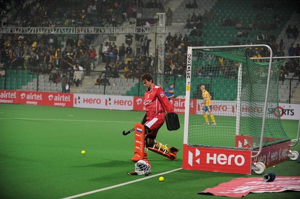 Dutch hockey goalkeeper Jaap Stockmann, playing for Punjab Warriors, warms up on the field prior to the inaugural match of the Hockey India League (HIL) between Punjab Warriors and Delhi Waveriders in New Delhi on January 14, 2013.