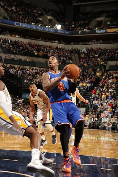 NDIANAPOLIS, IN - FEBRUARY 20:  J.R. Smith #8 of the New York Knicks protects the ball during the game between the Indiana Pacers and the NewYork Knicks
