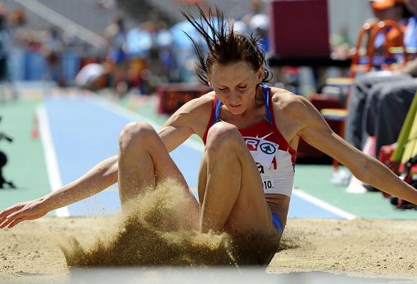 Russia&#039;s Tatyana Kotova falls on the san