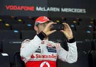 Jenson Button takes a picture of the new McLaren Mercedes MP4-28 in Woking, southern England, on January 31, 2013