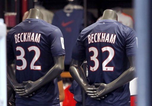 Shirts bearing the name of PSG&#039;s latest recruit David Beckham displayed at the PSG store in Paris on February 1, 2013