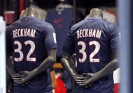 Shirts bearing the name of PSG's latest recruit David Beckham displayed at the PSG store in Paris on February 1, 2013