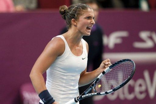 Italy&#039;s Sara Errani celebrates after beating Spain&#039;s Carla Suarez Navarro on February 1, 2013