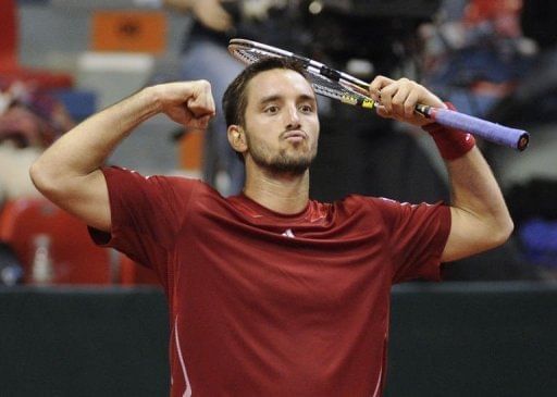 Serbia&#039;s Viktor Troicki celebrates after winning on February 1, 2013 in Charleroi