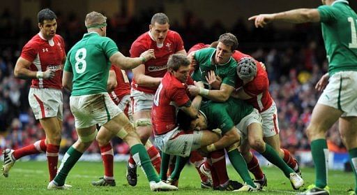 Wales&#039; Dan Biggar is tackled during a Six Nations Rugby Union match in Cardiff on February 2, 2013